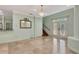Elegant foyer features marble floors, a crystal chandelier, staircase, and stained-glass front doors at 3428 Longleaf Rd, Ormond Beach, FL 32174
