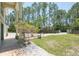 Exterior view of front porch with white rock area and tall columns at 3428 Longleaf Rd, Ormond Beach, FL 32174