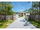Charming two-story home with manicured lawn, mature trees, and a long driveway at 3428 Longleaf Rd, Ormond Beach, FL 32174