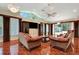 Spacious living room with a high ceiling, tile floors, and large windows at 3428 Longleaf Rd, Ormond Beach, FL 32174