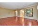 Bright living room with hardwood floors, arched doorways, and ample natural light at 3428 Longleaf Rd, Ormond Beach, FL 32174