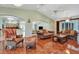 Living room with tile flooring, decorative ceilings, and open floor plan to kitchen at 3428 Longleaf Rd, Ormond Beach, FL 32174