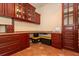 Home office featuring rich wood cabinetry and countertop, with a printer for convenience and functionality at 3428 Longleaf Rd, Ormond Beach, FL 32174
