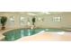 Indoor pool featuring a hot tub and a plant for decoration at 3428 Longleaf Rd, Ormond Beach, FL 32174