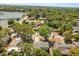 Stunning aerial view of a neighborhood with lush trees near a body of water and a scenic pier at 3655 Scott St, Port Orange, FL 32129