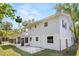 Back exterior of home shows patio and screened in porch at 3655 Scott St, Port Orange, FL 32129