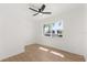 Bright bedroom with hardwood floors, ceiling fan, and large window at 3655 Scott St, Port Orange, FL 32129