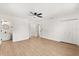Spacious bedroom with light wood floors, ensuite bathroom and ample closet space at 3655 Scott St, Port Orange, FL 32129