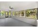 Large Florida room features many windows and backyard views at 3655 Scott St, Port Orange, FL 32129