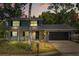 Front elevation of home at dusk showing the two car garage at 3655 Scott St, Port Orange, FL 32129