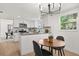 Eat-in kitchen with stainless appliances, light countertops and white cabinets at 3655 Scott St, Port Orange, FL 32129