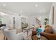 Bright living room featuring wood floors, modern furniture, and neutral color palette at 3655 Scott St, Port Orange, FL 32129