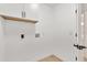 The utility room features overhead cabinets and is freshly painted at 3655 Scott St, Port Orange, FL 32129