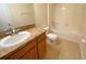 Traditional bathroom with a vanity and ample storage, a toilet and a shower-tub combo at 405 Carina Cir, Sanford, FL 32773