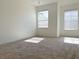 Bright bedroom with neutral carpet, fresh paint, and plenty of natural light at 405 Carina Cir, Sanford, FL 32773