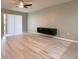 Spacious living area with modern floating shelf and sleek floors at 405 Carina Cir, Sanford, FL 32773
