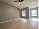 Open living area with new laminate flooring, fresh paint, and lots of natural light at 405 Carina Cir, Sanford, FL 32773