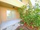 Relaxing covered patio area, adorned with beautiful hibiscus flowers, offering a serene outdoor space at 405 Carina Cir, Sanford, FL 32773