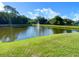 Beautiful pond with fountain feature surrounded by lush landscaping, offering a tranquil community space at 405 Carina Cir, Sanford, FL 32773