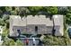 Overhead view showing roof, parking, and landscaping at 4403 Sea Mist Dr # 2110, New Smyrna Beach, FL 32169