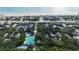 Stunning aerial view of a beach community featuring lush green trees, a pool, and tennis courts at 4403 Sea Mist Dr # 2110, New Smyrna Beach, FL 32169