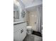 Clean bathroom with a shower-tub combination and a white vanity with granite countertops at 4403 Sea Mist Dr # 2110, New Smyrna Beach, FL 32169