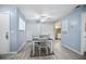 Dining area with tile floors, a ceiling fan, and access to the kitchen and entryway at 4403 Sea Mist Dr # 2110, New Smyrna Beach, FL 32169