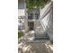 Exterior shot of a condo entrance with stairs leading to the second level and a shaded entry area at 4403 Sea Mist Dr # 2110, New Smyrna Beach, FL 32169