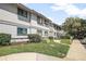 Exterior shot of a condominium showing well maintained landscaping and a walkway to the front door at 4403 Sea Mist Dr # 2110, New Smyrna Beach, FL 32169