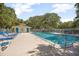 Community pool with ample seating and a convenient bathhouse for residents to enjoy at 4403 Sea Mist Dr # 2110, New Smyrna Beach, FL 32169