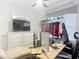 Bright bedroom with a large window, walk-in closet, and neutral decor, featuring a versatile workstation at 456 Sea Duck Dr, Daytona Beach, FL 32119