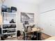 Bright bedroom featuring a white shelving unit, a work station, and black and white art at 456 Sea Duck Dr, Daytona Beach, FL 32119