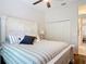 Bright bedroom featuring ample closet space, neutral colors, and a ceiling fan at 456 Sea Duck Dr, Daytona Beach, FL 32119