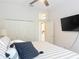 Bright bedroom featuring ample closet space, neutral colors, and a ceiling fan at 456 Sea Duck Dr, Daytona Beach, FL 32119