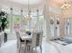 Dining room featuring large windows, neutral color palette, and open floor plan at 456 Sea Duck Dr, Daytona Beach, FL 32119