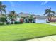 Beautifully landscaped single-story home with a well-maintained front yard at 456 Sea Duck Dr, Daytona Beach, FL 32119