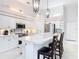 Bright kitchen with white cabinetry, stainless steel appliances, and a spacious center island at 456 Sea Duck Dr, Daytona Beach, FL 32119