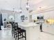 Kitchen features an island with bar seating and pendant lights, and modern appliances at 456 Sea Duck Dr, Daytona Beach, FL 32119