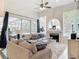 Living room with plush seating, fireplace, and sliding glass doors to the screened-in patio at 456 Sea Duck Dr, Daytona Beach, FL 32119