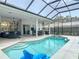 In-ground swimming pool and lanai offering a refreshing outdoor experience at 456 Sea Duck Dr, Daytona Beach, FL 32119