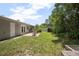 Great backyard space featuring lush greenery, an outdoor patio, and a cozy fire pit at 502 W Hogle Ave, Deland, FL 32720