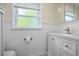 Bathroom featuring a window, sink, and toilet at 502 W Hogle Ave, Deland, FL 32720