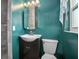 A full bathroom features a modern vanity with a vessel sink, tiled shower, and green-painted walls at 502 W Hogle Ave, Deland, FL 32720