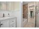 This bathroom features a shower-tub combo and sink at 502 W Hogle Ave, Deland, FL 32720