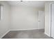This bedroom features neutral walls, carpet flooring, a window, and closet access at 502 W Hogle Ave, Deland, FL 32720