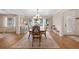 Inviting dining room with wainscotting, a large window, and a chandelier at 505 Black Ironwood Dr, Deland, FL 32724