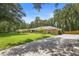 Charming single-story home featuring a long driveway, stone accents, and a beautifully landscaped front yard at 505 Black Ironwood Dr, Deland, FL 32724
