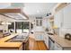 Well-appointed kitchen with modern appliances, a butcher block island, and a view of the outdoor pool area at 505 Black Ironwood Dr, Deland, FL 32724