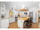 Bright and airy kitchen with stainless steel appliances, white cabinets, and a butcher block island with seating at 505 Black Ironwood Dr, Deland, FL 32724