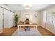 Bright home office with a sliding barn door, neutral walls, and hardwood floors at 505 Black Ironwood Dr, Deland, FL 32724